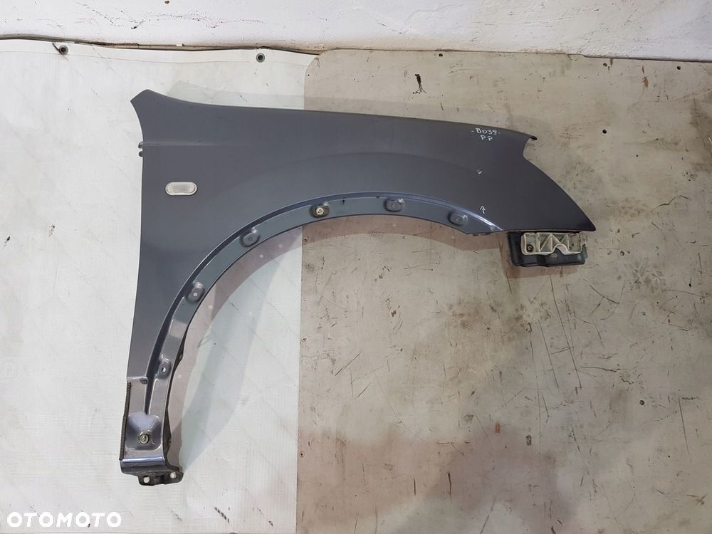 BŁOTNIK PRAWY PRZÓD NISSAN QASHQAI J102 EUR 09R B52