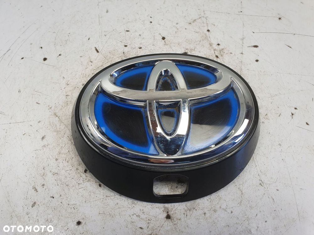Toyota Corolla XII E21 hybrid ZNACZEK TYLNEJ KLAPY Emblemat Logo - 1