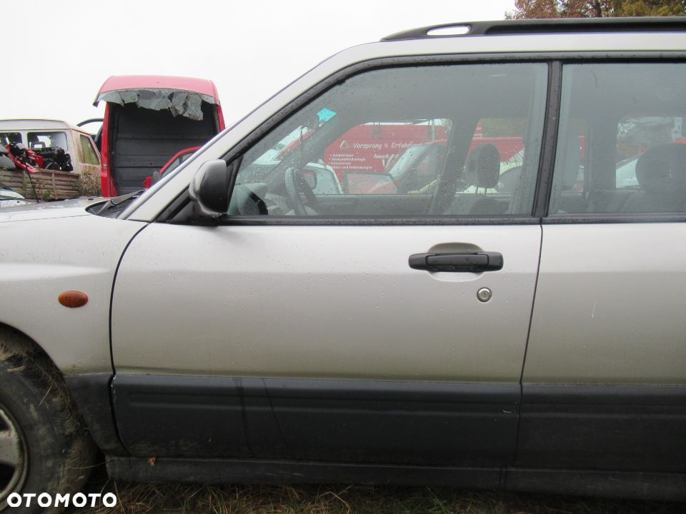 PODNOŚNIK SZYBY PRZÓD PRAWY LEWY SUBARU FORESTER I - 1