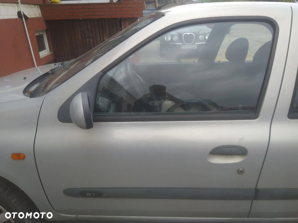 Renault Thalia drzwi przód lewe srebne (bez lusterek)