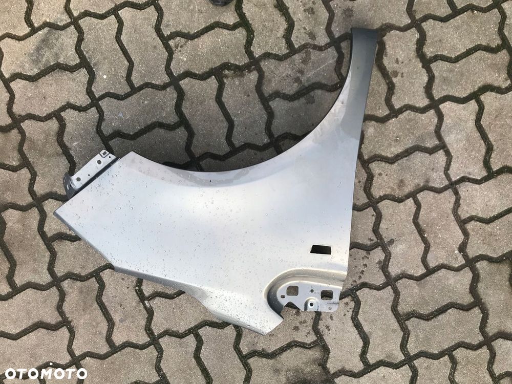 BŁOTNIK PRAWY OPEL MERIVA B - 2