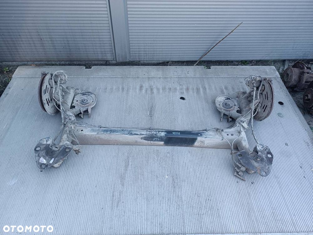 BELKA OŚ ZAWIESZENIA TYŁ TARCZE Z ABS RENAULT KANGOO II - 1