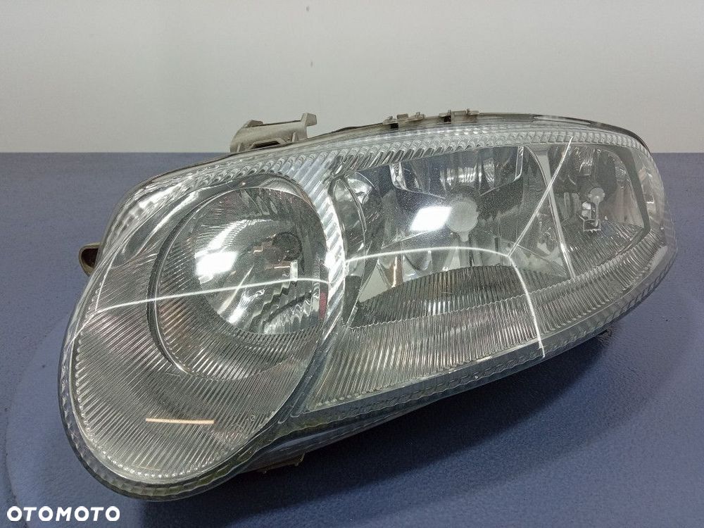 ALFA ROMEO 147 REFLEKTOR LEWY LAMPA H1 H7 EU 465565640 - 1