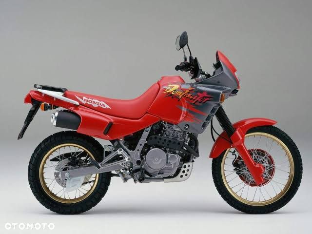 HONDA DOMINATOR 650 reflektor lampa czasza owiewka wypełnienie licznik błotnik kierownica lusterko manetka felga tarcza zacisk pompa zawieszenie silnik moduł regulator zbiornik siedzenie set podnóżek stelaż stopka chłodnica tłumik - 1
