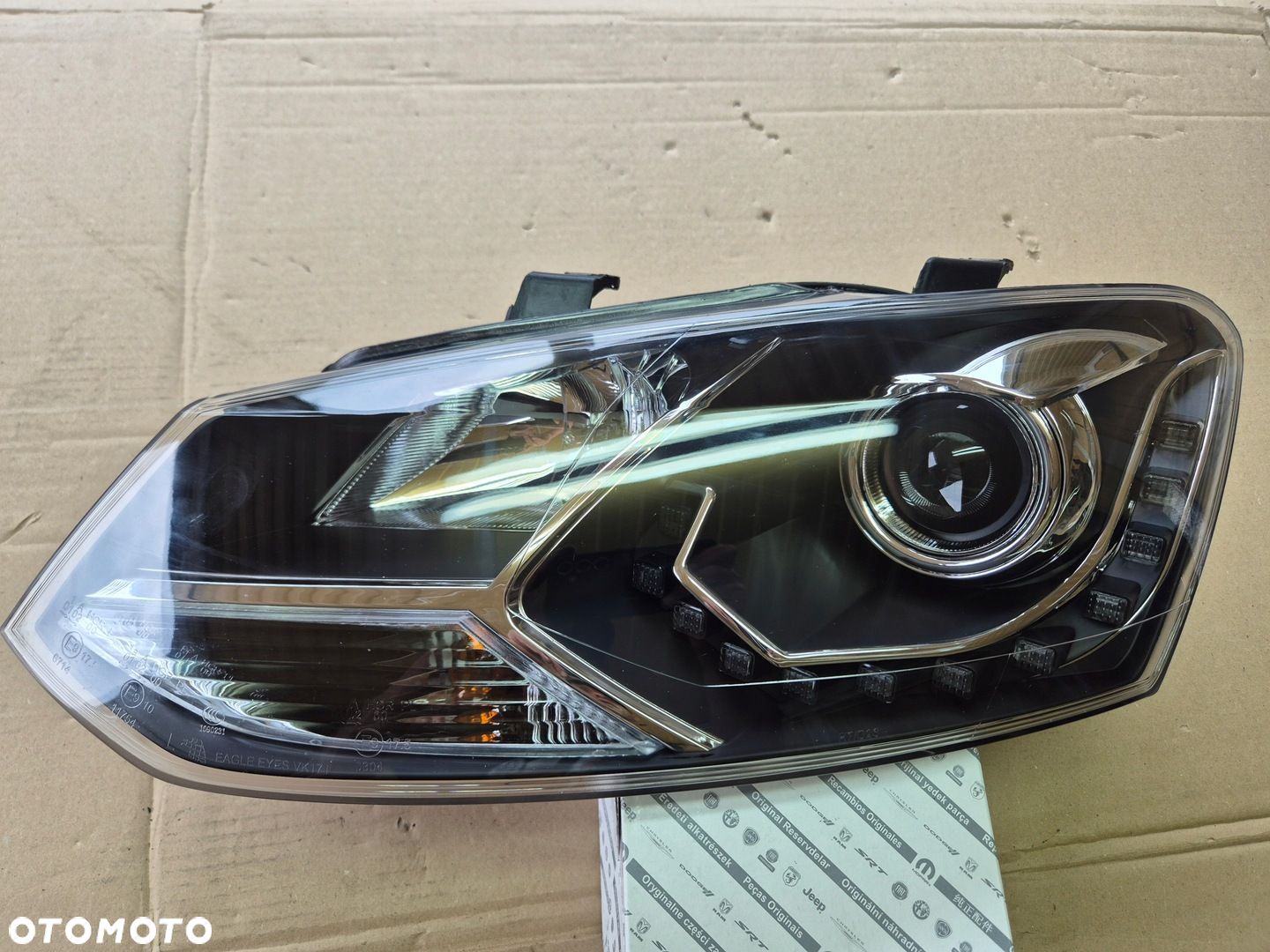 Volkswagen Golf VII reflektor lewy.Eagle Eyes.100 - 1