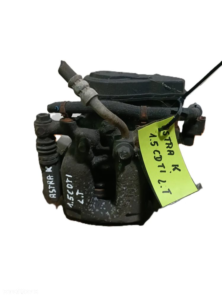 OPEL ASTRA K 15-21 r. ZACISK HAMULCOWY z JARZMEM LEWY TYŁ ELEKTRYCZNY + - 1