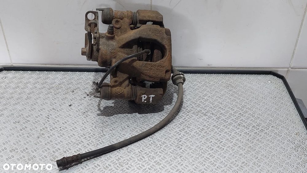 ZACISK HAMULCOWY PRAWY TYŁ ORYGINAŁ RENAULT MASTER III 3 2,3 DCI - 1