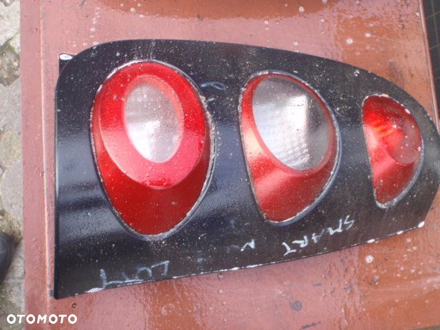 lampa tył tylna nakładka oprawka żarówki smart  Posiadam prawie wszystkie części do tego modelu - 9