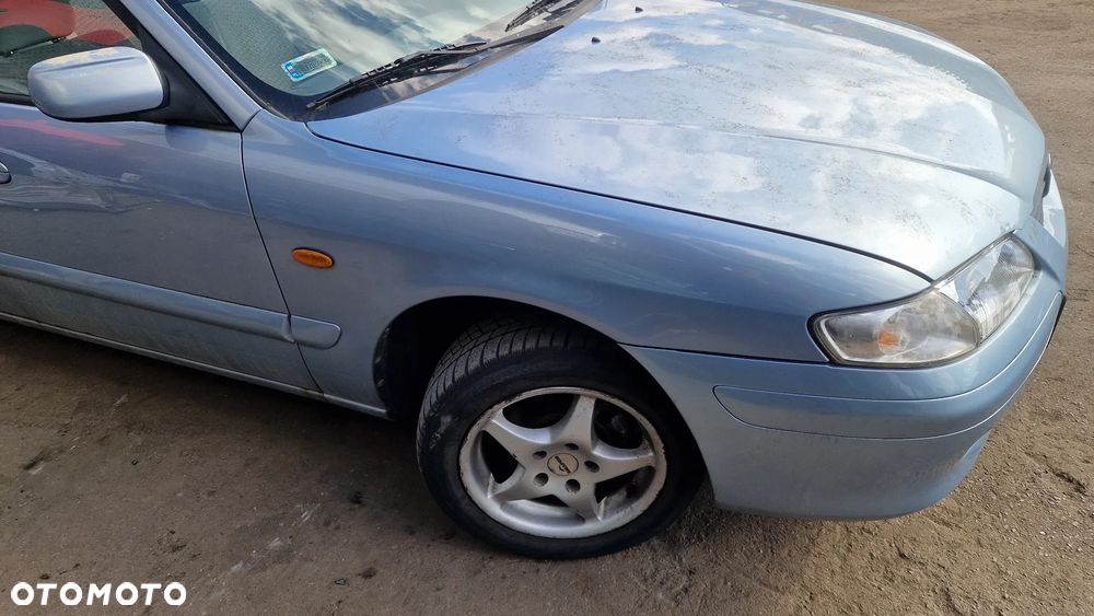 MAZDA 626 V GF BŁOTNIK PRAWY PRZÓD - 1