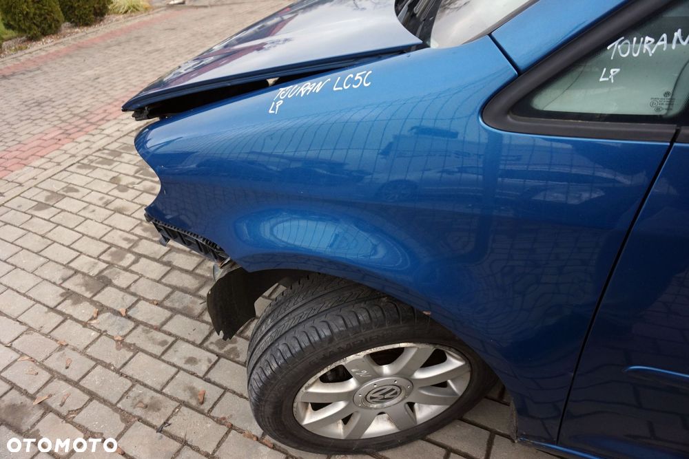 BŁOTNIK PRZEDNI LEWY TOURAN I LIFT FL1 LC5C 1T0821021B NIEBIESKI VOLKSWAGEN 2006-2010 - 1