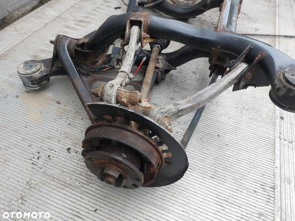 BELKA OŚ ZAWIESZENIA TYŁ PORSCHE CAYENNE I 02-10r 3.2 V6 - 4