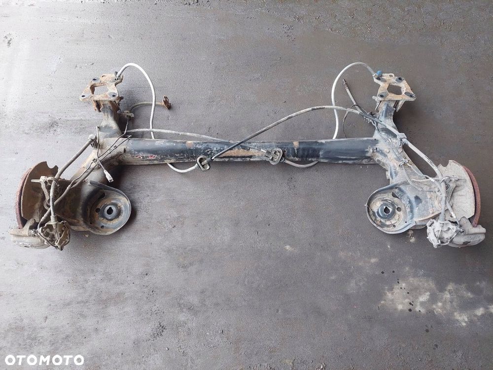 BELKA OŚ ZAWIESZENIA TYŁ TARCZE Z ABS CITROEN BERLINGO II PARTNER II - 1
