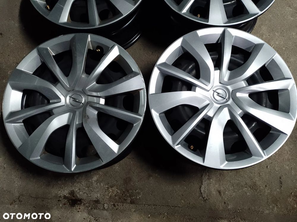 Felgi OPEL 4x108,15- ET20,kołpaki - 2