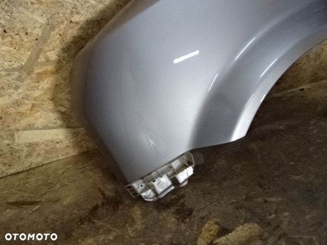 BŁOTNIK LEWY PRZÓD PRZEDNI NISSAN CUBE Z11 LAK:KYO - 2