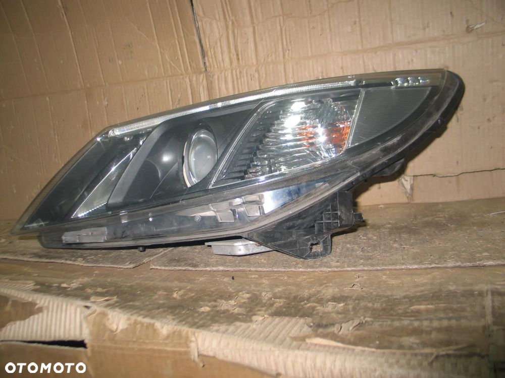 lampa xenon przod saab 93 9-3 2 II lift 07-14r. oryginal europa - 9