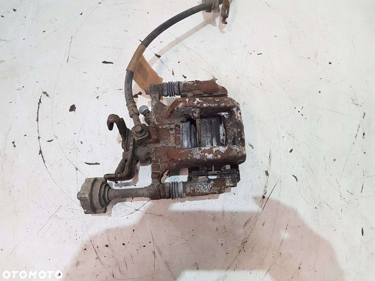 ZACISK HAMULCOWY PRAWY TYŁ OPEL ASTRA J EUR - 7