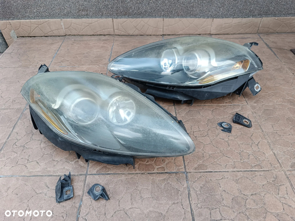 Fiat Croma 2 II fl Lift (08-11) Reflektor Lewy Prawy lampa przód lewa prawa XENON 51824216 51824214 Europa