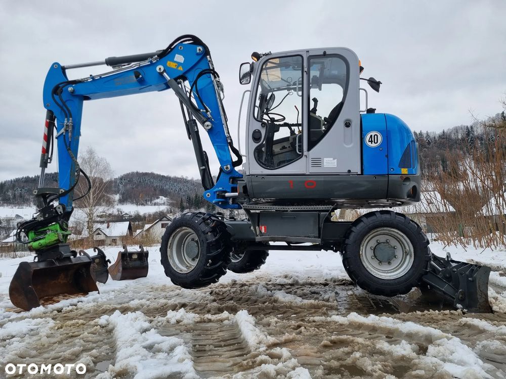 Wacker Neuson EW100 Koparka Kołowa 11 ton. 3x Ramię +ROTOTIL z regulacją szybkości+ Skosowanie Hydr+Pompa ON Łyżki. z Norwegii Jak Nowa z salonu! 2086mtg PERKINS silnik. STABILIZATORY Klima. DEKRA 2026r. Książka serwisowa. Szybkozłącze Hydr. Opcja podpięcia samego wiertła do gleby. - 2