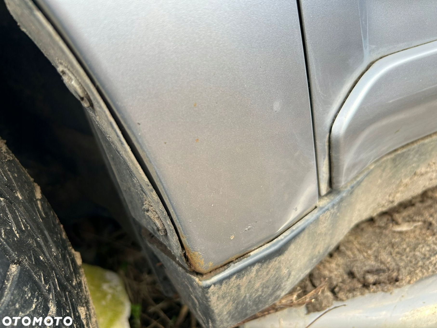 BŁOTNIK LEWY PRZÓD MITSUBISHI OUTLANDER II - 2