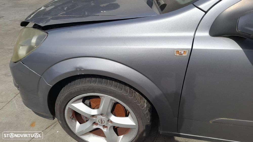 Guarda-lamas esquerdo OPEL Astra H Caravan (L35) - 1