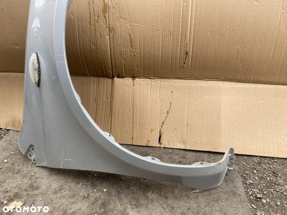 Błotnik Toyota Yaris I prawy OE - 3