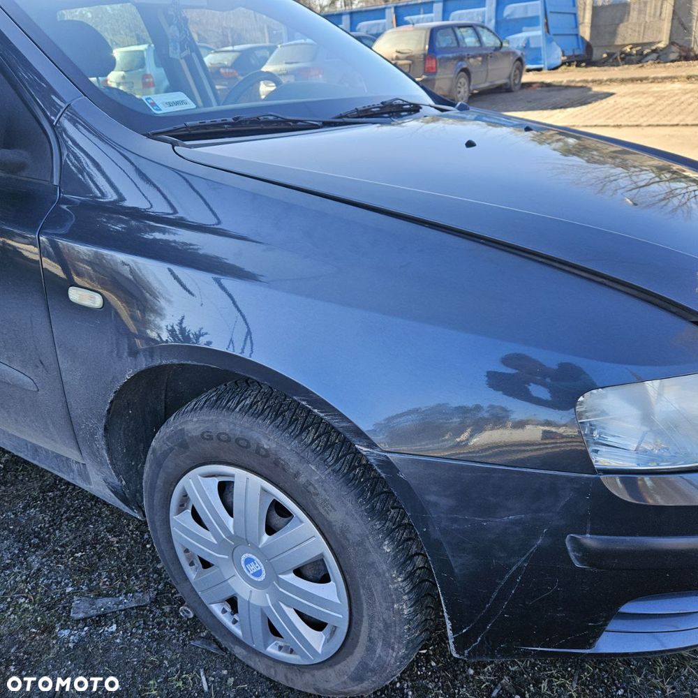 Fiat Stilo 1,6 B 76 kW / 103 KM (2003 kombi) (kod lak: 675) pojazd na części: maska, zderzak, drzwi, szyby, lusterka, chłodnica ... - 8