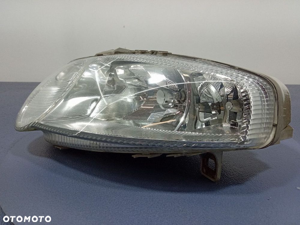 ALFA ROMEO 147 REFLEKTOR LEWY LAMPA H1 H7 EU 465565640 - 2