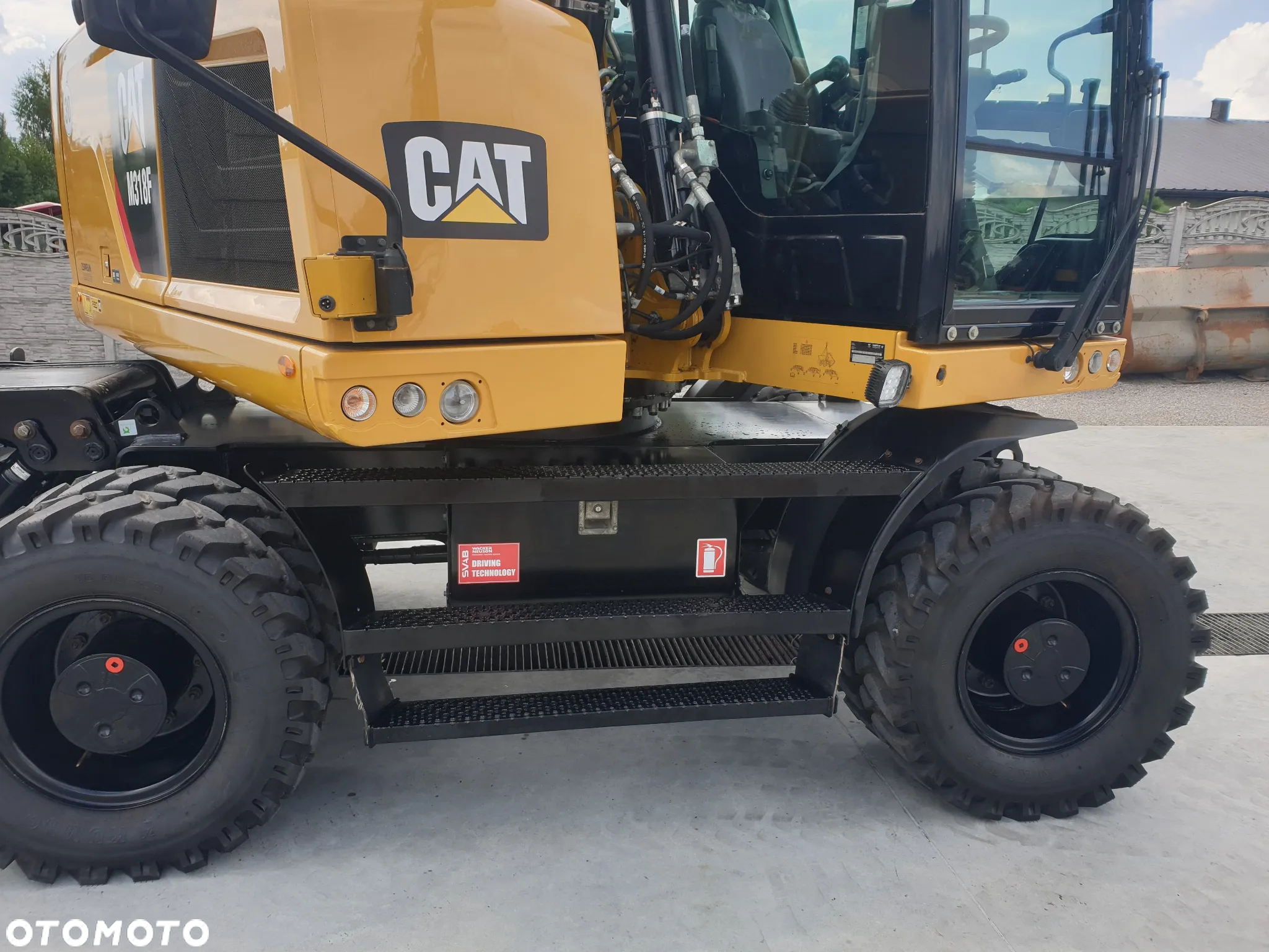 Caterpillar M 318 F ROTOTILT SPROWADZONY ŁADNY STAN - 38