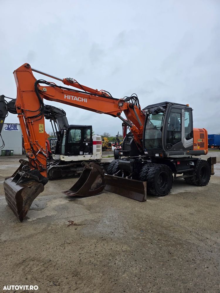 Hitachi ZX145 - W excavator pe roti pe pneuri compact - 1