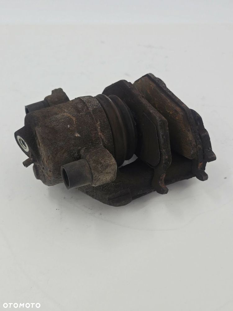 ORYGINALNY ZACISK HAMULCOWY PRAWY PRZEDNI AUDI SKODA VW 1K0615124E