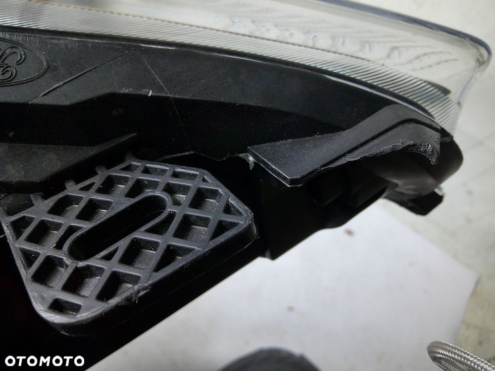 ford fiesta mk7 lampa przód lewa nowa oryg z uszk - 2