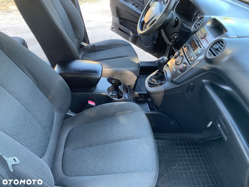 Kia Carens 2.0 CVVT LX - 21