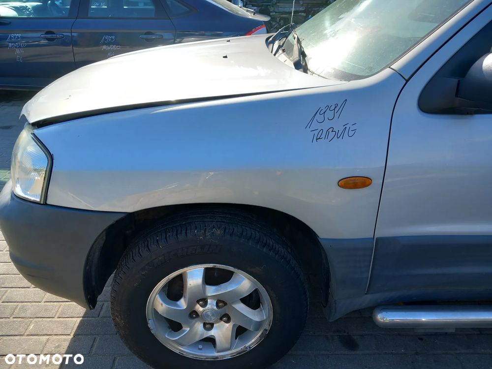 MAZDA TRIBUTE BŁOTNIK LEWY PRZEDNI LEWY PRZÓD