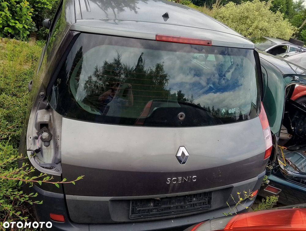 Renault Megane Scenic (03-06r.) 1.9DCI 119KM. Silnik F9Q 812 Skrzynia ND0 002 lakier NV603 – HOLOGRAM GREY . Cały na części. GWARANCJA !!!  Przód Tył Zestaw Komplet Drzwi Klapa Zderzak Błotnik Maska Grill Atrapa Szyba Pas Lampa Lusterko Boczki Fotel Kanapa Kokpit Deska Rozdzielcza Przełącznik Włącznik Sterownik Przewody Wiązka Instalacja Moduł Komputer Czujnik Listwa Pompa Alternator Wtryski Głowica Rozrusznik Kompresor Sprzęgło Dwumas Silnik Skrzynia ABS Klimatyzacji Paliwa Wspomagania Kolektor Turbina Przepustnica Zawór Chłodnica Koło Hak Belka Sanki Zawieszenie Mcpherson Półoś Amortyzator Wydech Tłumik Zacisk Most - 2