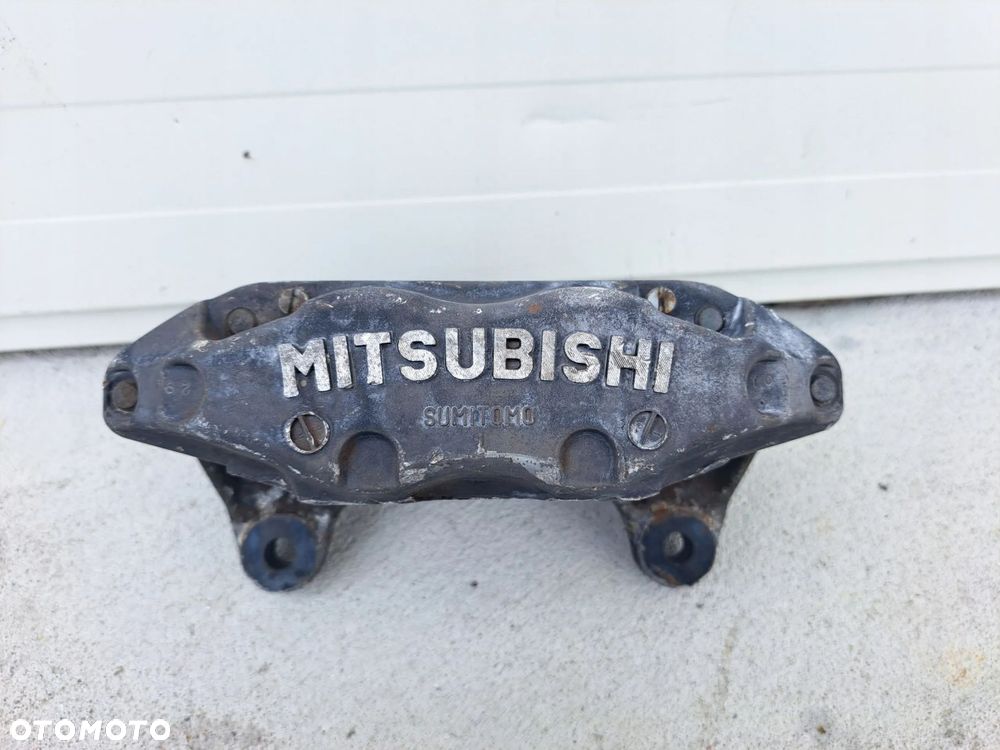 ZACISK LEWY PRZÓD PRZEDNI MITSUBISHI GTO 3000GT VR - 1