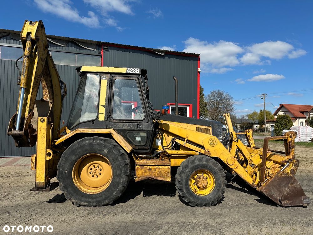 Caterpillar 428B ramię typu Banan - 15