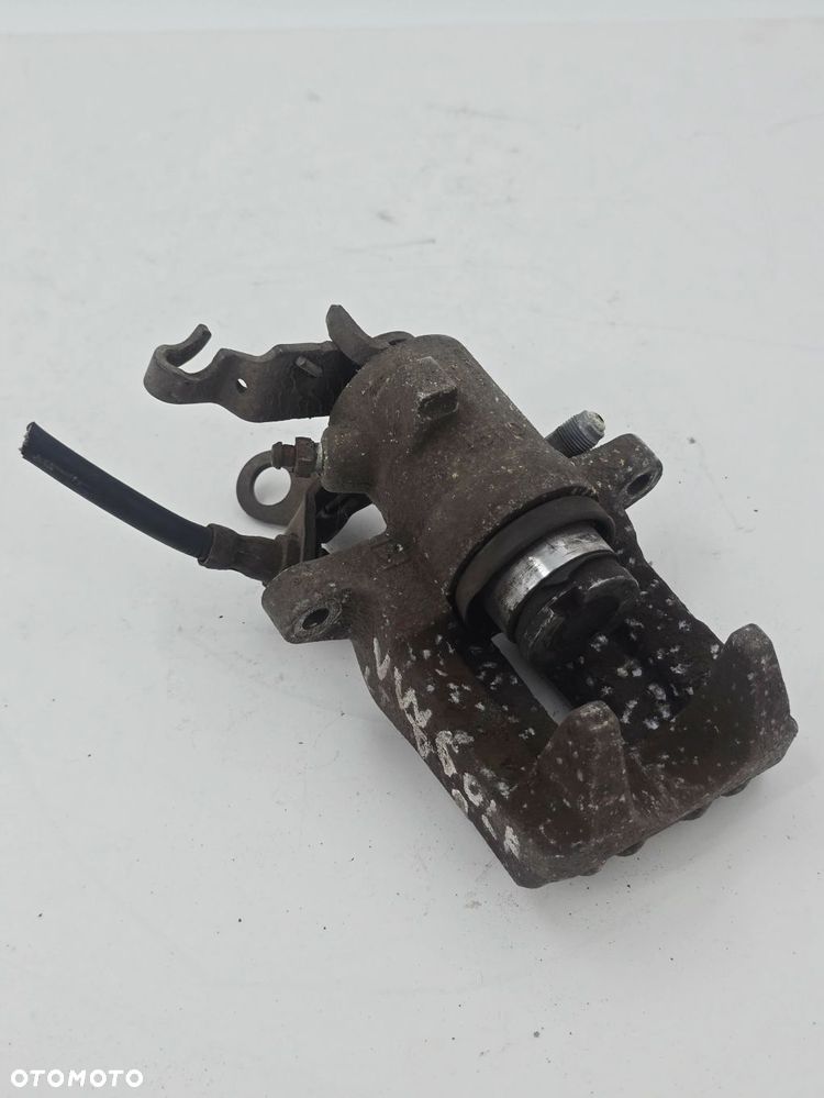 ORYGINALNY ZACISK HAMULCOWY LEWY TYŁ VW GOLF V 1K1 1K0615423