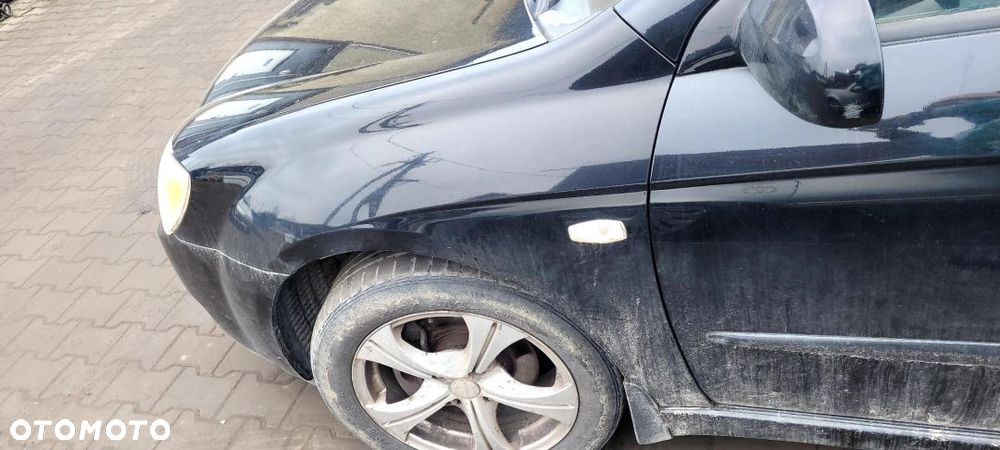 BŁOTNIK LEWY PRZÓD KIA CERATO - 1