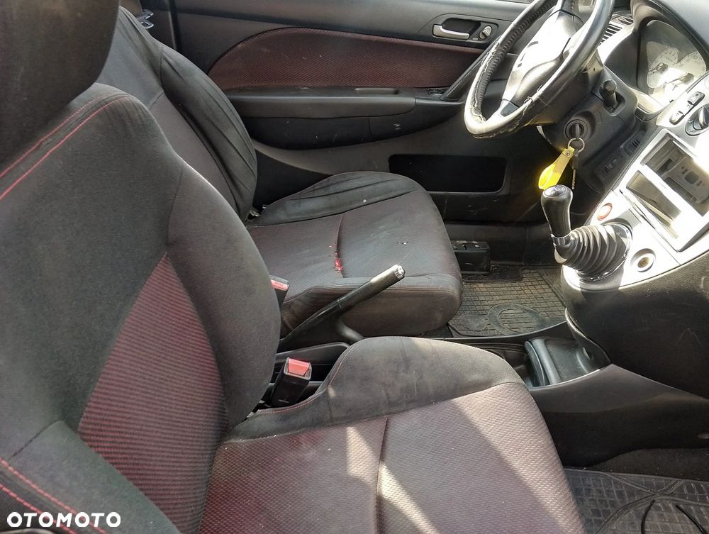 Honda Civic VII FL (04-06r.) 1.4 B 89KM. Silnik D14Z6 Skrzynia.Cały na części. GWARANCJA !!! Przód Tył Zestaw Komplet Drzwi Klapa Zderzak Błotnik Maska Grill Atrapa Szyba Pas Lampa Lusterko Boczki Fotel Kanapa Kokpit Deska Rozdzielcza Przełącznik Włącznik Sterownik Przewody Wiązka Instalacja Moduł Komputer Czujnik Listwa Pompa Alternator Wtryski Głowica Rozrusznik Kompresor Sprzęgło Dwumas Silnik Skrzynia ABS Klimatyzacji Paliwa Wspomagania Kolektor Turbina Przepustnica Zawór Chłodnica Koło Hak Belka Sanki Zawieszenie Mcpherson Półoś Amortyzator Wydech Tłumik Zacisk Most - 8