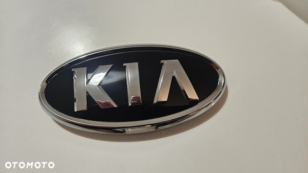 Emblemat znaczek Kia Sportage III przedni przód 10-15 NOWY