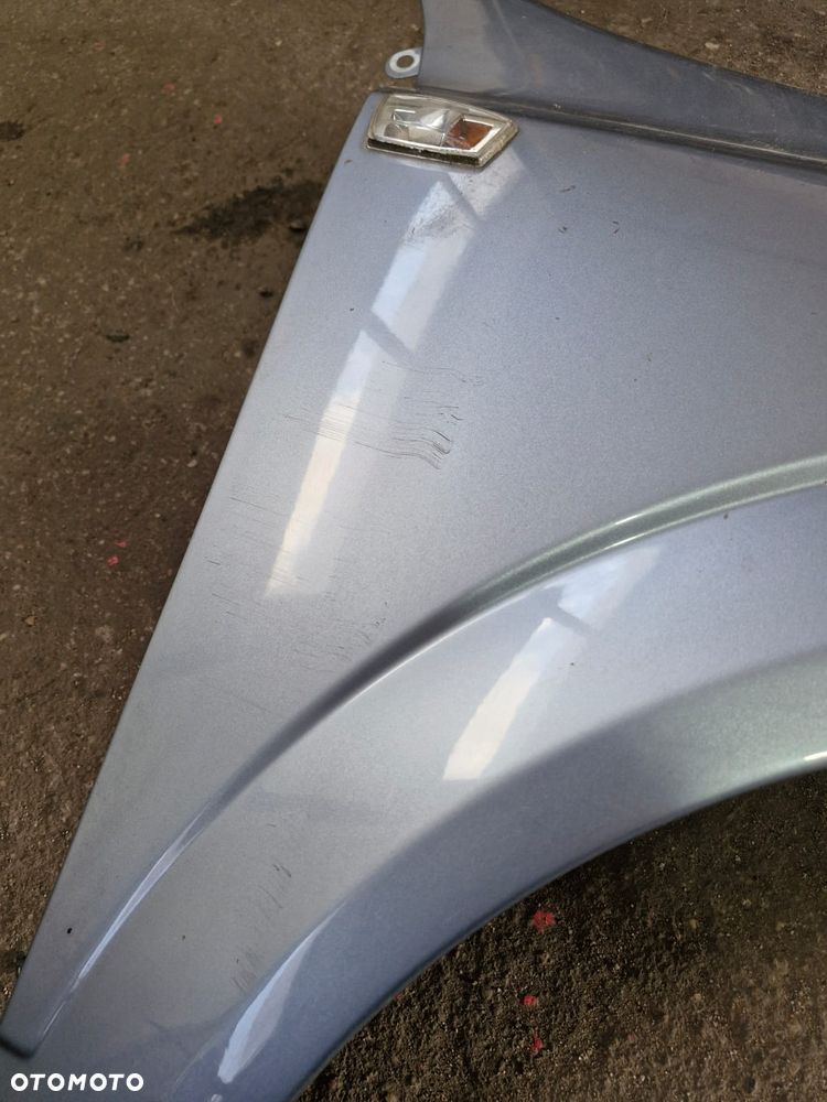 Błotnik prawy przedni przód Opel Astra H III Z163 oryginał - 2
