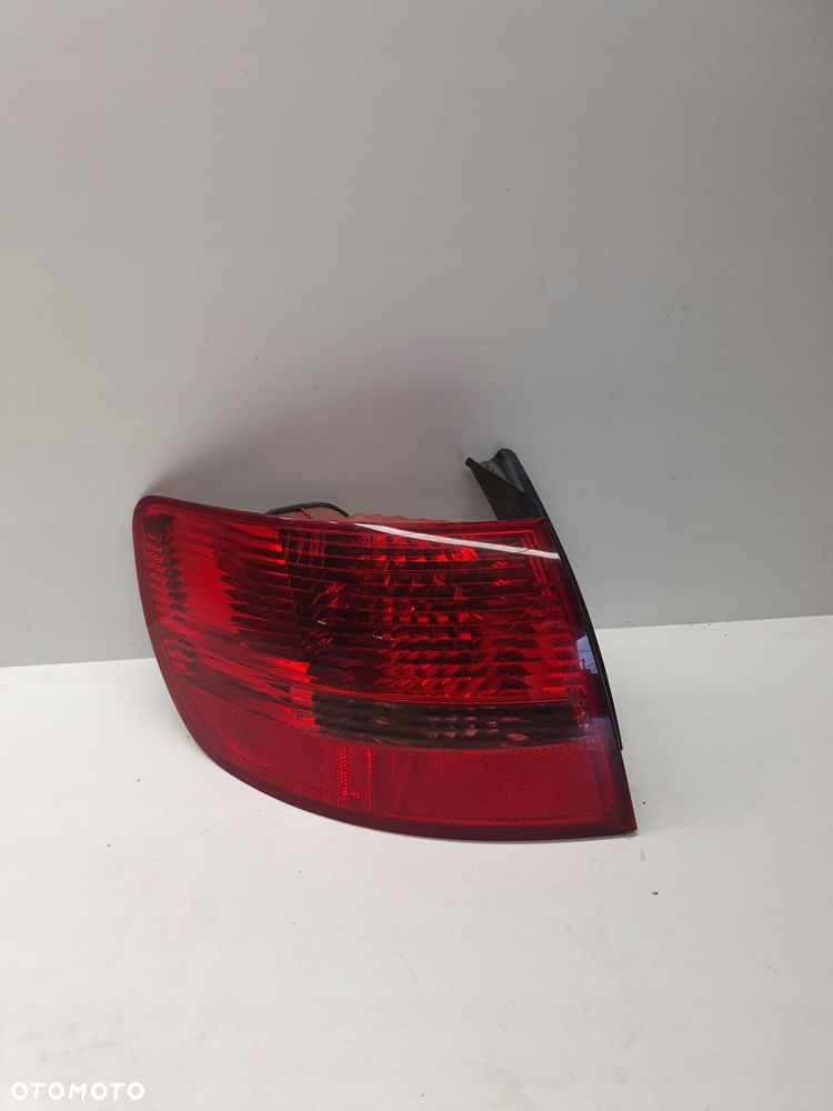 LAMPA LEWY TYŁ W BŁOTNIK AUDI A6 C6 4F9945095 - 1