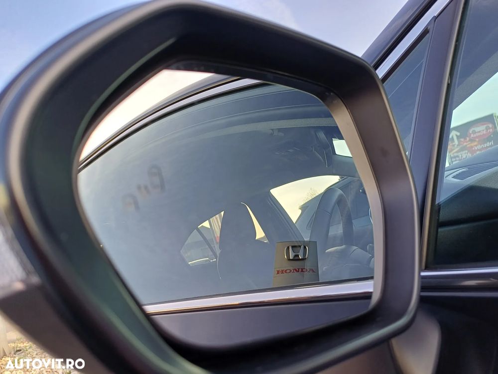 Toyota Corolla TS 1.8 HSD Exclusive - 23