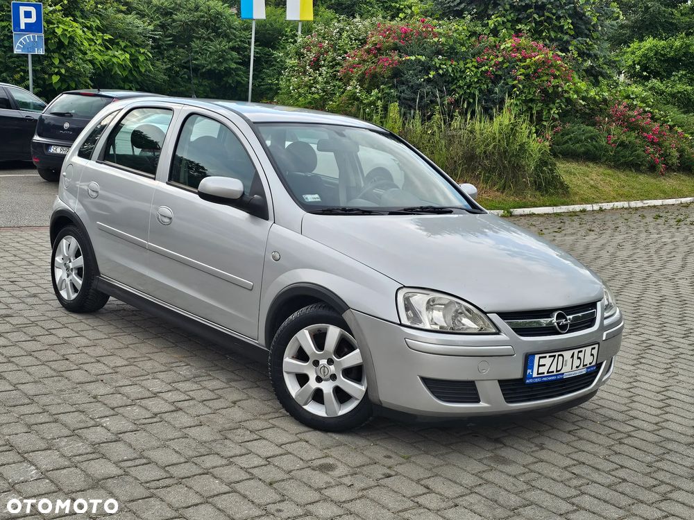 Opel Corsa 1.0 12V Edition mit TomTom GO - 1