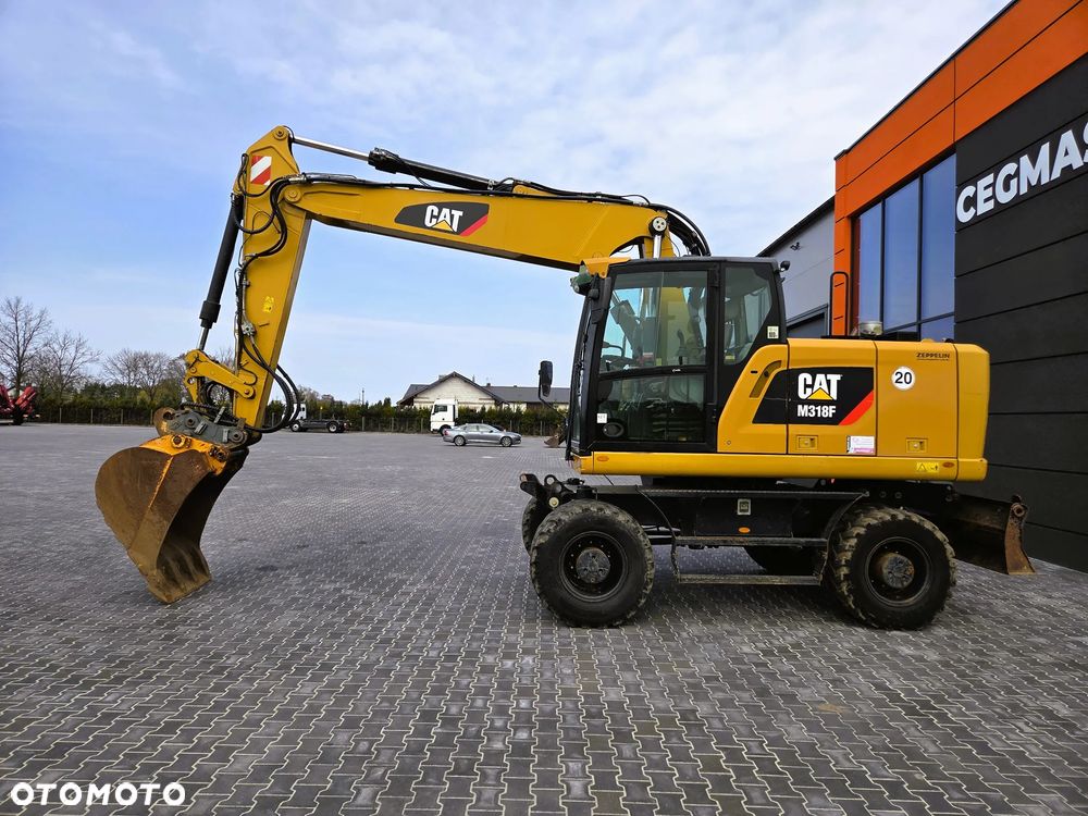 Caterpillar M 318F / z Niemiec /  9300 mth / - 5