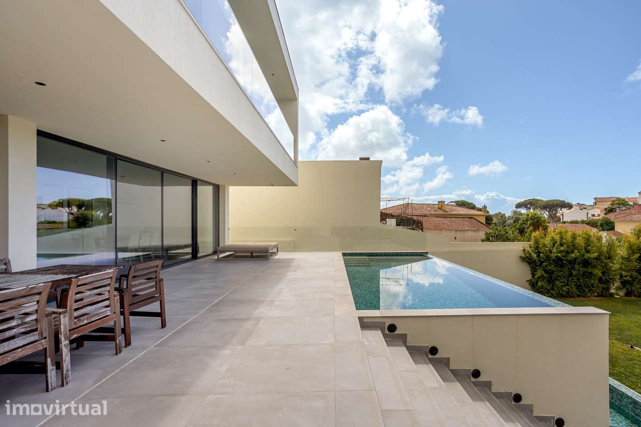 Moradia T4 contemporânea com jardim e piscina no bairro da Martinha, E - Grande imagem: 4/32