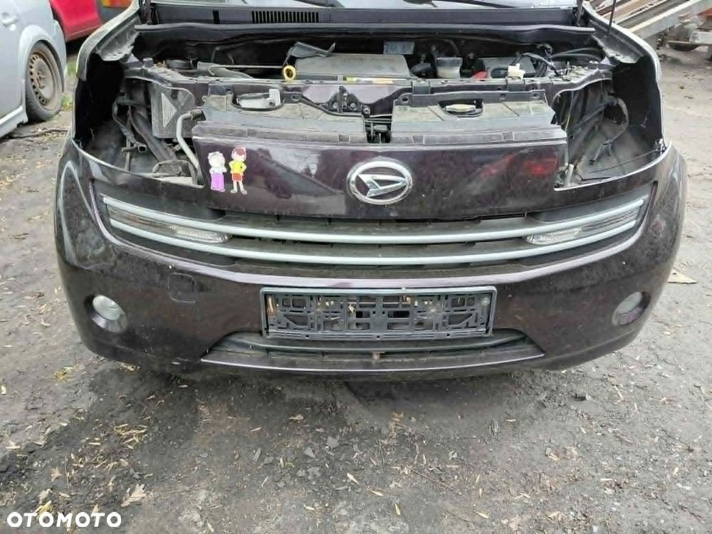 Zderzak przedni zderzak przód Daihatsu Materia Rok 2008 Pojemność 1298 Moc 67 kw Benzyna - 1