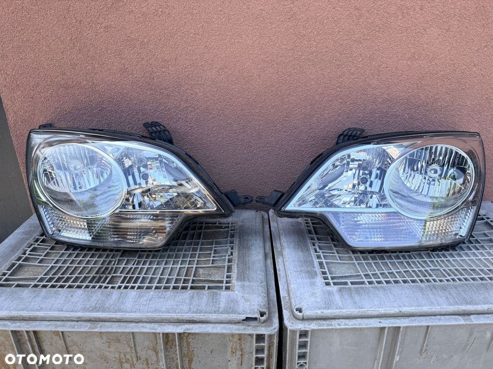 Lampa przednia OPEL ANTARA ZWYKŁE KOMPLET EUROPA ORYGINALNE - 1