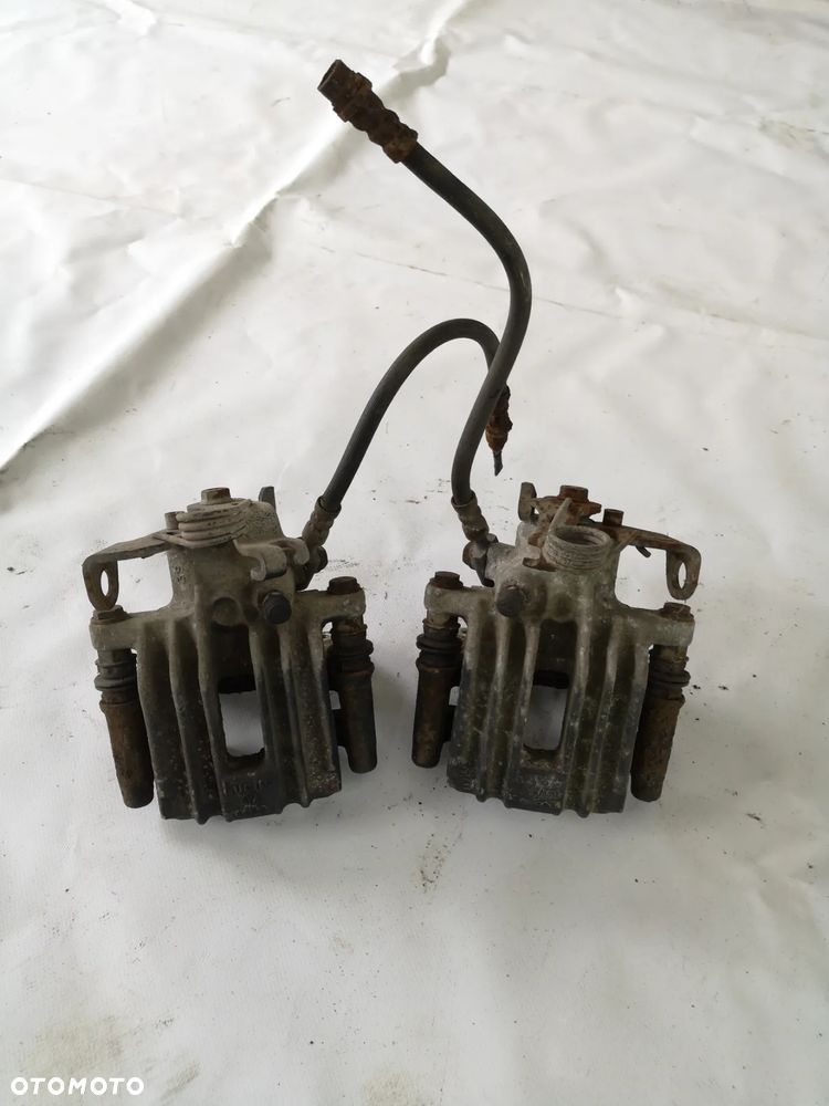 ZACISK HAMULCOWY TYŁ TYLNY LEWY PRAWY AUDI A4 B6 B7 - 1