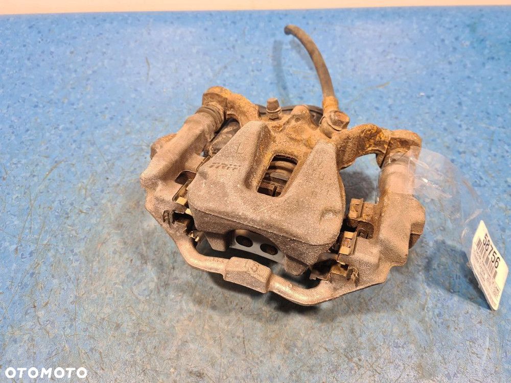 TOYOTA COROLLA E21 ZACISK HAMULCOWY TYŁ LEWY - 1
